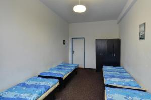 Postel nebo postele na pokoji v ubytování Sporthotel BK Pod Lipou