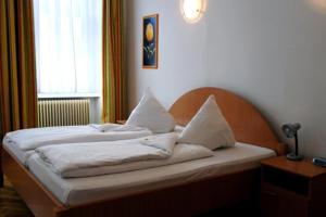 Postel nebo postele na pokoji v ubytování Suite Hotel 200m zum Prater