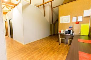 an office with a desk and a counter in a room at Rivyersky Hostel in Sochi