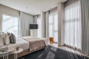 Voodi või voodid majutusasutuse 65 Hotel, Rothschild Tel Aviv - an Atlas Boutique Hotel toas