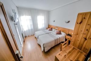 Postel nebo postele na pokoji v ubytování Alvi