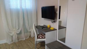 TV a/nebo společenská místnost v ubytování B&B I Tre Sensi