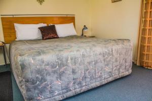 Cama o camas de una habitación en Bella Tuscany Motor Lodge