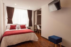 Hotel Plaza Carnaval客房内的一张或多张床位