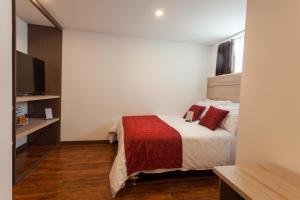 Hotel Plaza Carnaval客房内的一张或多张床位