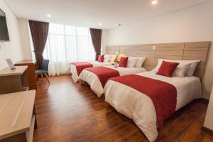 Hotel Plaza Carnaval客房内的一张或多张床位