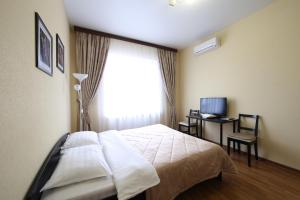 Säng eller sängar i ett rum på Smart People Eco Hotel