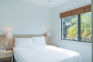 Uma cama ou camas num quarto em Waves