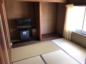 TV a/nebo společenská místnost v ubytování Guesthouse Kumano