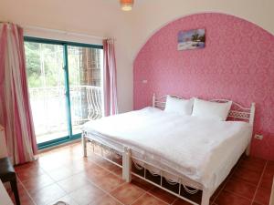 Postel nebo postele na pokoji v ubytování Rainbow B&B