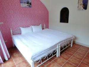 Postel nebo postele na pokoji v ubytování Rainbow B&B