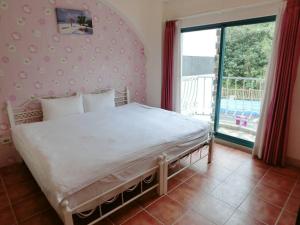 Postel nebo postele na pokoji v ubytování Rainbow B&B