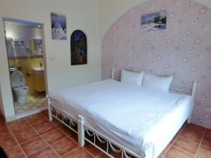 Postel nebo postele na pokoji v ubytování Rainbow B&B