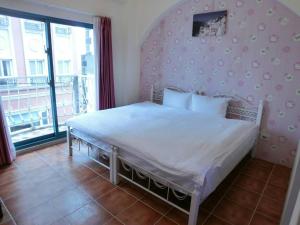 Postel nebo postele na pokoji v ubytování Rainbow B&B