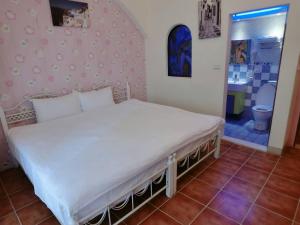 Postel nebo postele na pokoji v ubytování Rainbow B&B