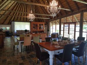 a dining room with a table and chairs at Hunter's Lodge in Ladysmith