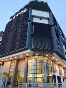 a building with people walking in front of it at The Leverage Lite (Kuantan) in Kuantan