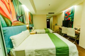 Postel nebo postele na pokoji v ubytování Aziza Paradise Hotel