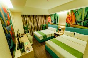 Postel nebo postele na pokoji v ubytování Aziza Paradise Hotel