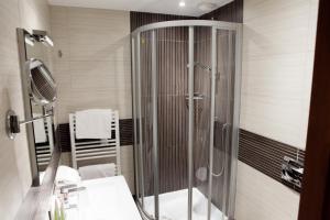 a bathroom with a shower and a sink at Hotel Villa d'Elsa in Juan-les-Pins