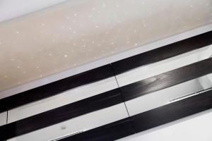 a bed frame with black and white stripes at Hotel Villa d'Elsa in Juan-les-Pins