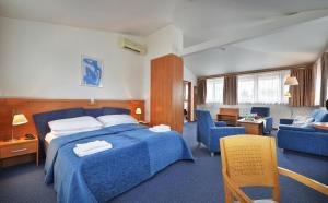 Postel nebo postele na pokoji v ubytování EA Hotel Populus