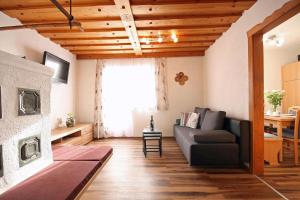 a living room with a couch and a window at Almliesl ZELL-448 in Zell am See