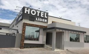 a hotelier sign on the front of a building at Lider Hotel in Jataí