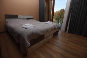 Ένα ή περισσότερα κρεβάτια σε δωμάτιο στο Apartment near didveli ski area