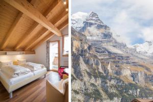 a bedroom with a view of a mountain at Hotel Blumental in Mürren