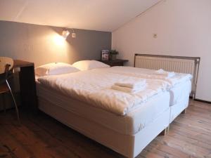 Llit o llits en una habitació de Haus Irmgard by Châtel Reizen