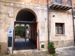 an entrance to a building with an open door at Baglio Bonomo in Castelbuono