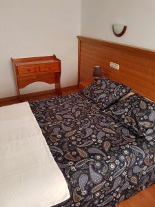 Voodi või voodid majutusasutuse Hotel Merino toas