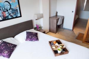 Giường trong phòng chung tại Hotel Villa d'Elsa