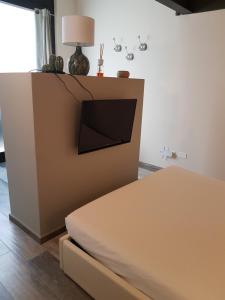 A bed or beds in a room at Domus Navigli