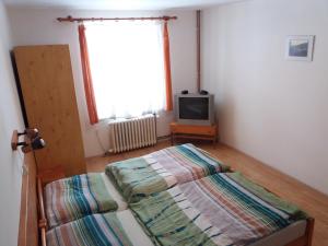 Posteľ alebo postele v izbe v ubytovaní U Nás - Apartmán Jelen