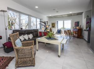 a living room with a couch and a table at Villa Carabeo San Salvador Nerja in Nerja