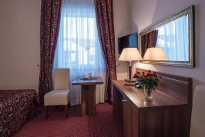 Posteľ alebo postele v izbe v ubytovaní Jasek Premium Hotel Wrocław