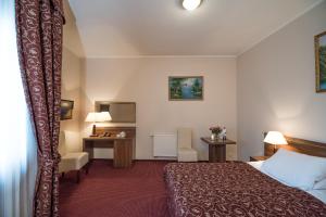 Posteľ alebo postele v izbe v ubytovaní Jasek Premium Hotel Wrocław