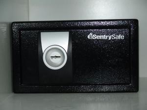 a black safe with a picture of a knife at Hotel Cosmos in Athens