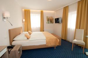 Postel nebo postele na pokoji v ubytování Hotel Biedermeier Hof