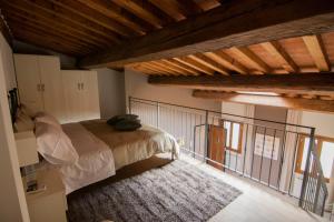 a bedroom with a bed and a balcony at Sweet Home In Santa Croce in Florence