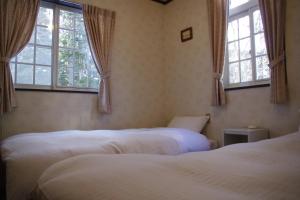 Cama o camas de una habitación en Sunny Side Hut