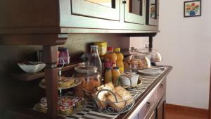 a kitchen counter with food and condiments at B&B Cavalieri in San Felice Circeo