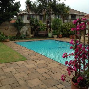a swimming pool in the backyard of a house at Broadway in Durban