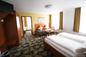Postel nebo postele na pokoji v ubytování Hotel Der Tannenbaum