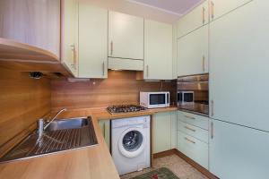 Kuchyň nebo kuchyňský kout v ubytování B&B Gloria Apartment