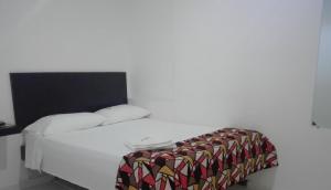 Ліжко або ліжка в номері Rio Hotel Montería