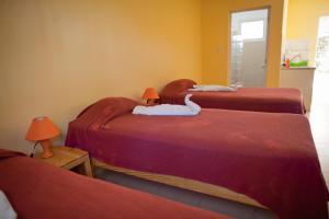 Un ou plusieurs lits dans un hébergement de l'établissement Kite Beach Inn