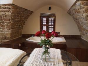 Rúm í herbergi á Lighthouse Suite - Acre